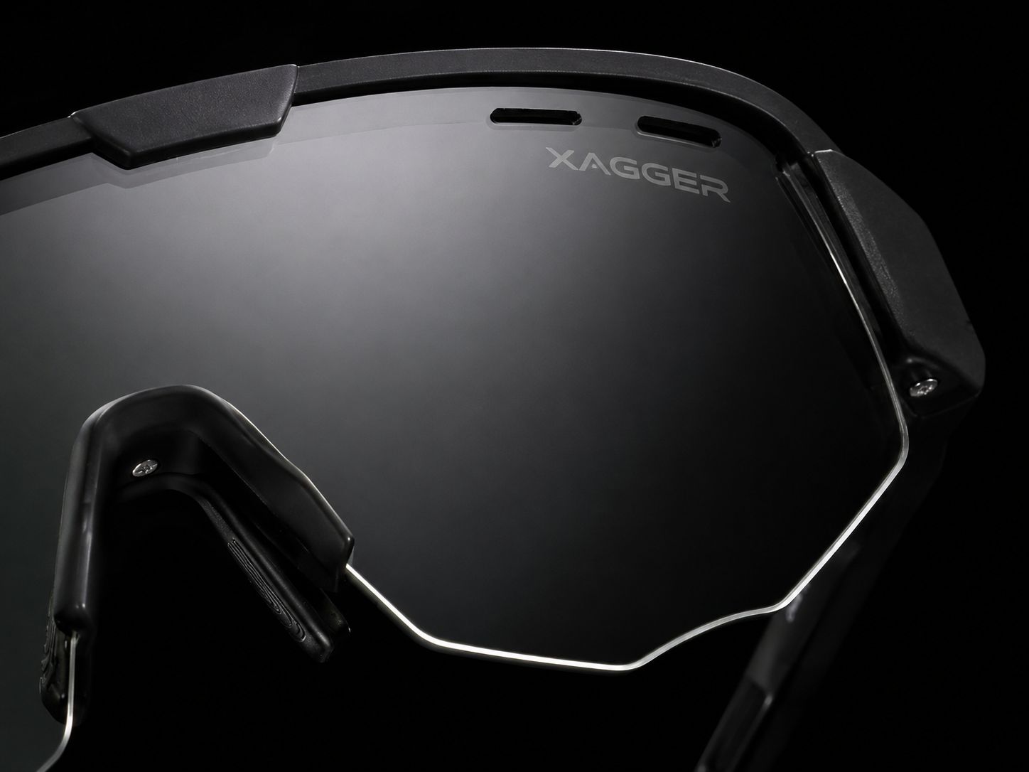 Macro of a XAGGER Premium Shield polarized lens, etched wordmark